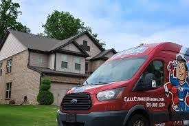 Branded Climate Heroes service van parked in the road in front of a neighborhood home