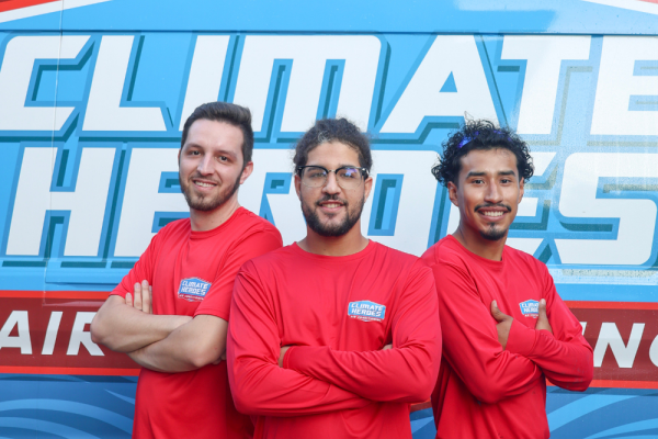 3 installers smiling and posing in front of a van